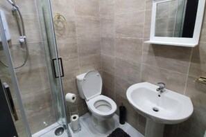 Shower, towels, toilet paper