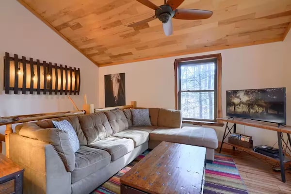 Main floor living area with TV streaming, board games, and plenty of DVD movies