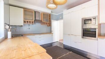 Fridge, coffee/tea maker, highchair, cookware/dishes/utensils