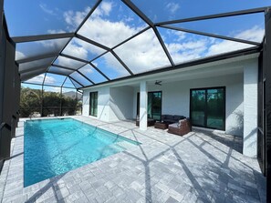 Outdoor pool, a heated pool - Modern Retreat 3BR/2BA w/Pool in Rotonda West (Rotonda West)