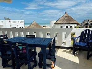 Triple Room, Partial Sea View | Living area | 32-inch flat-screen TV with digital channels