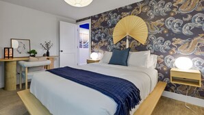 A bedroom with a bed, bedside tables, a desk, and a chair. - 5BD Japanese-Themed w/ Hot Tub, Movie Room & Games (Arvada)