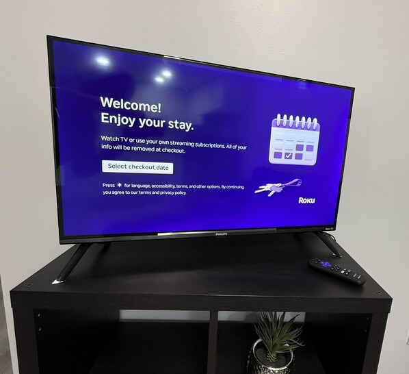 A television displaying a welcome message and a calendar icon.