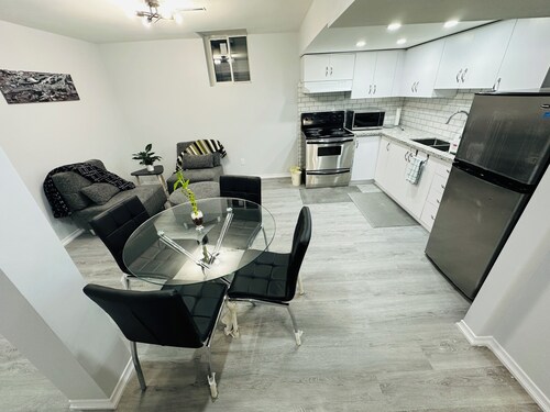 Two bedroom cozy bsmt home in prime location including parking & laundry room!