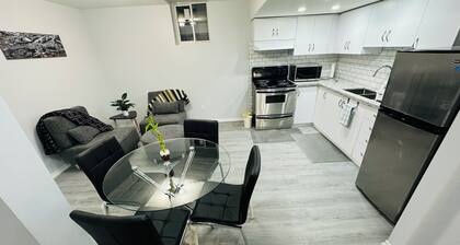 Two bedroom cozy bsmt home in prime location including parking & laundry room!
