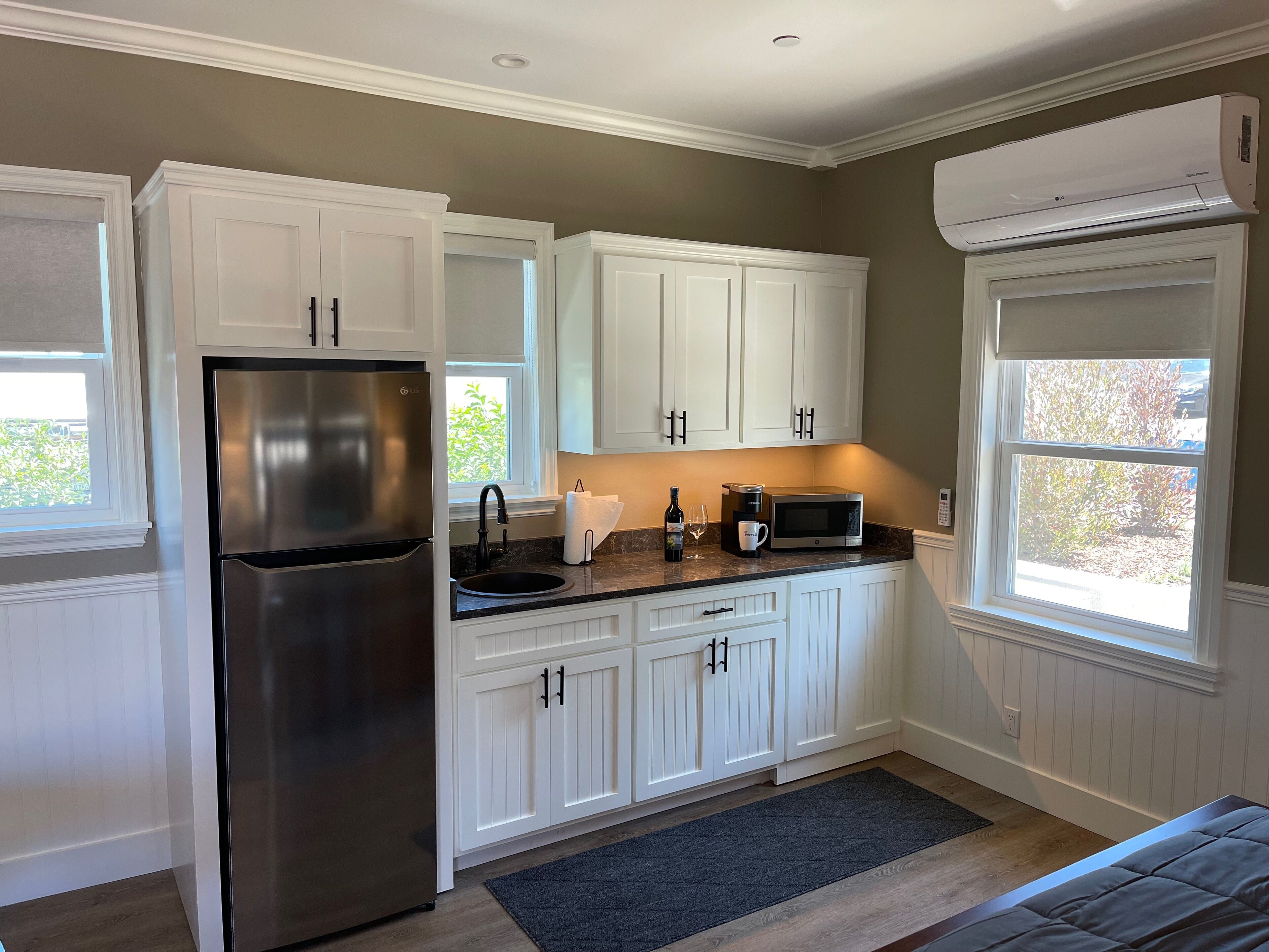 Fridge, microwave, coffee/tea maker, cookware/dishes/utensils