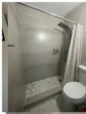 Shower, towels, soap, toilet paper