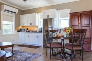 Fridge, microwave, coffee/tea maker, cookware/dishes/utensils