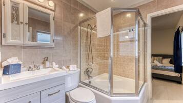 Shower, hair dryer, towels, shampoo