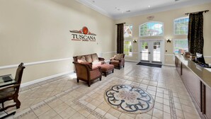 A spacious lobby with a high ceiling, a reception desk, two sofas, and a patterned rug. - Orlando Condo 6448 Getaway: 3BR Near Disney Magic (Orlando)