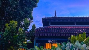 A building with a tiled roof and a sign that reads "Royale Riviera Hotel." - Royale Riviera Resort Private Pool Villas (Langkawi)