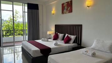 Deluxe Triple Room, Balcony | Desk, free WiFi