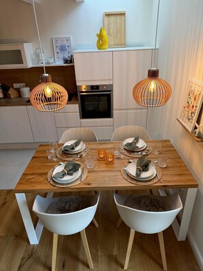 Dining - "Fenja" - Cozy maisonette apartment with terrace in the historic courtyard in Rysum - (Rysum)