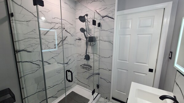 Shower, hair dryer, towels, soap