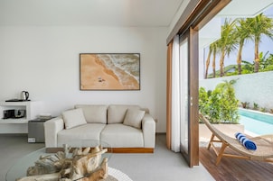 Deluxe Suite, Pool View | Living area | Smart TV