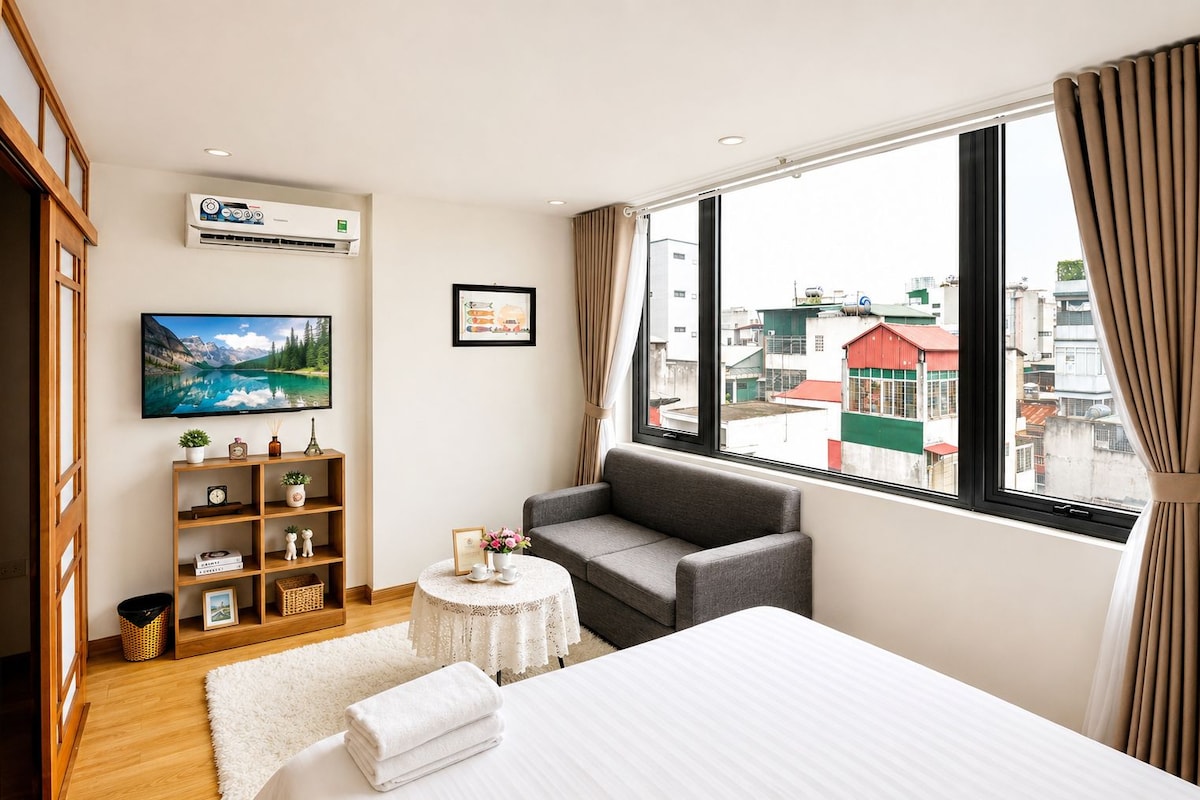 Deluxe Apartment, City View | Minibar, in-room safe, laptop workspace, blackout drapes