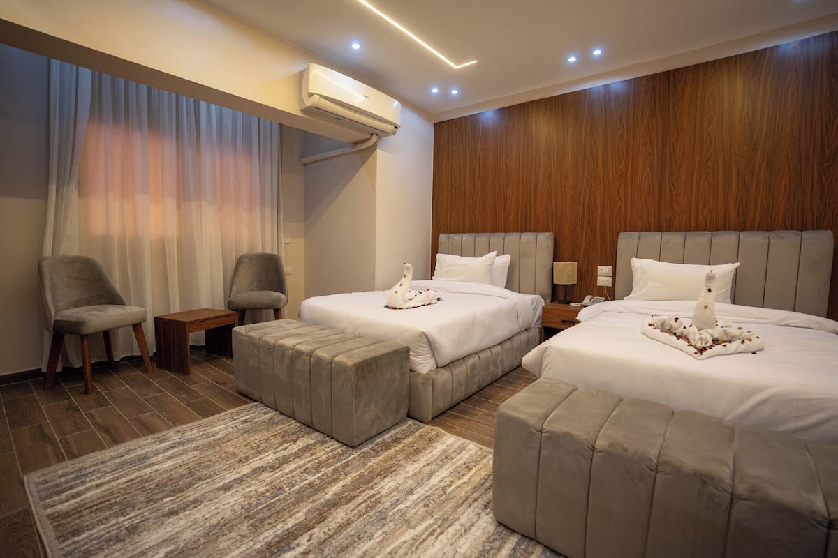 Deluxe Double or Twin Room | Minibar, individually decorated, desk, blackout drapes