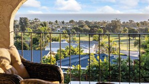 A balcony with a view of a residential area, including houses and a golf course. - @Marbella Lane - Home w/ Ocean & Golf Course Views (San Clemente)