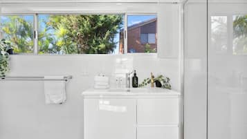 Shower, hair dryer, towels, toilet paper
