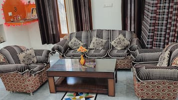 Standard Room, Balcony, City View | Living area | 32-inch LED TV with satellite channels