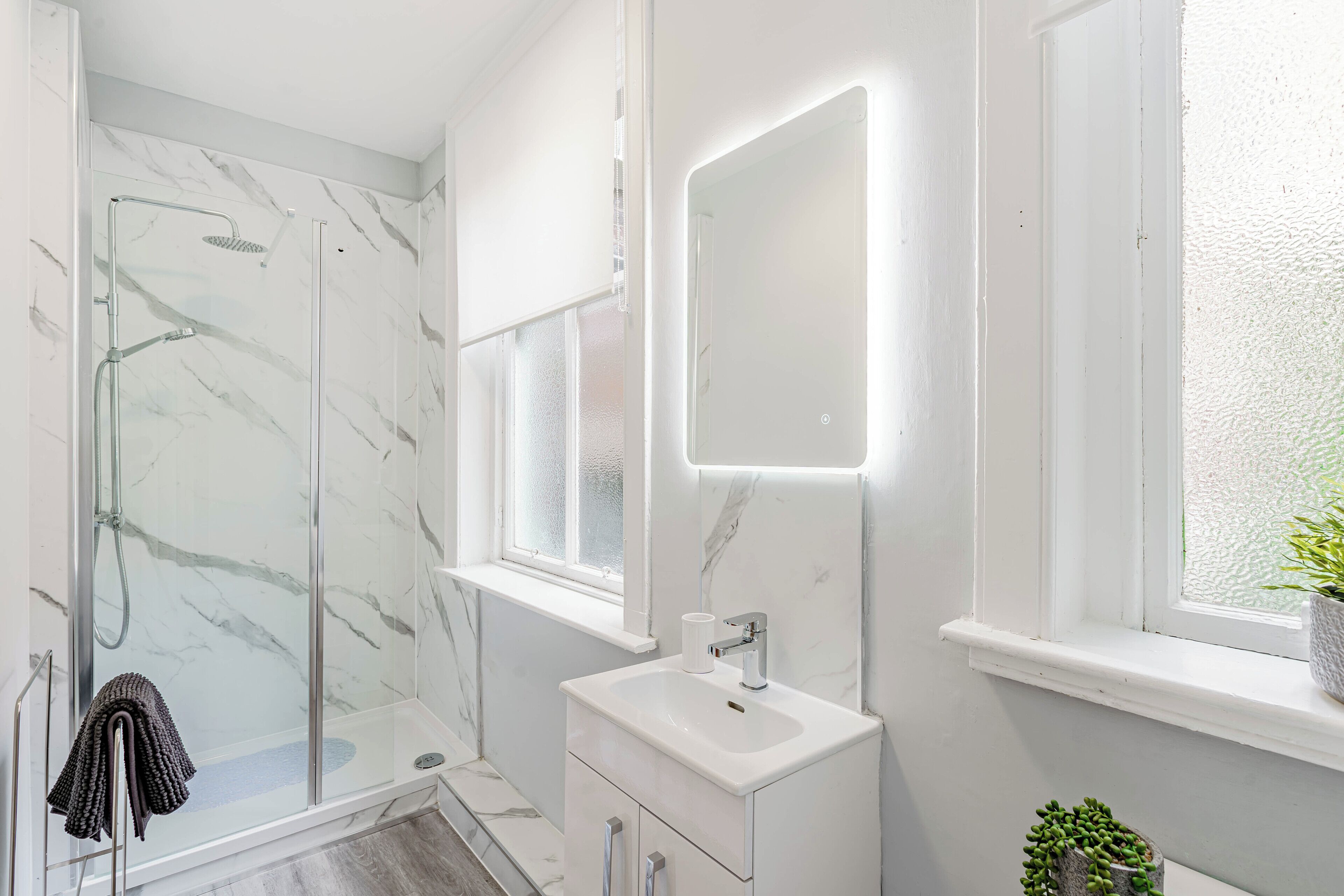 Shower, hair dryer, towels, toilet paper