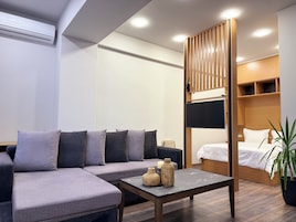 Superior Apartment, Non Smoking, Kitchen | Living area | 70-inch Smart TV with cable channels