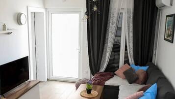 Apartment (Two Bedroom Apartment with Terrace) | Living room | 32-inch flat-screen TV with cable channels