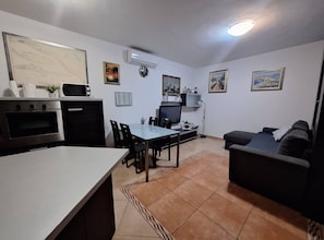 House (Four Bedroom Holiday Home) | Living room | 32-inch flat-screen TV with cable channels - Peaceful Island Haven With Pool, BBQ & Games Area (Supetar)