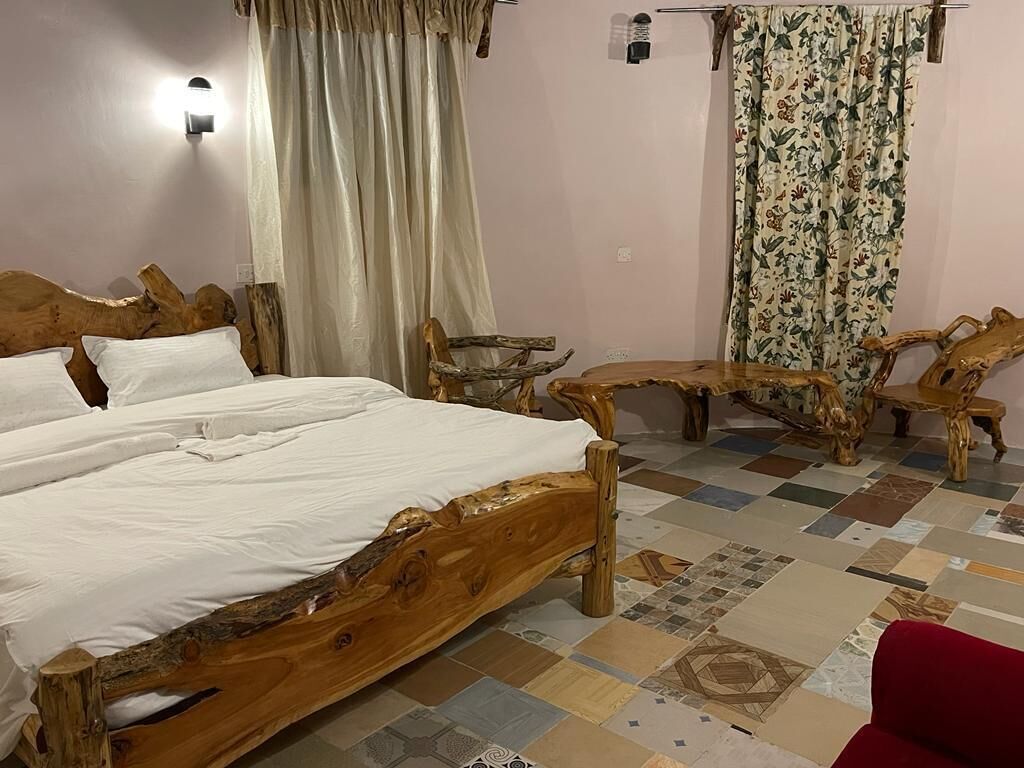 Deluxe Double Room, Garden View | Desk, laptop workspace, blackout drapes, free WiFi