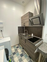 Microwave, stovetop, cookware/dishes/utensils