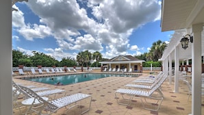 A pool area with lounge chairs and a covered pavilion. - The Villages Home 2 Mi to Farmers & Crafts Market (Lady Lake)