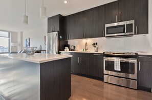 Fridge, microwave, oven, stovetop - Modern Apt Downtown Seaport with Gym (Boston MA)