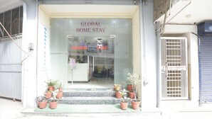 A storefront with a sign reading "GLOBAL HOME STAY". - HOTEL LUXURY GLOBAL STAY (New Delhi)