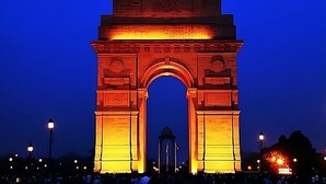 A large, illuminated arch structure at night. - HOTEL LUXURY GLOBAL STAY (New Delhi)