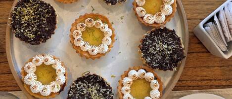 A tray of assorted tarts on a table.