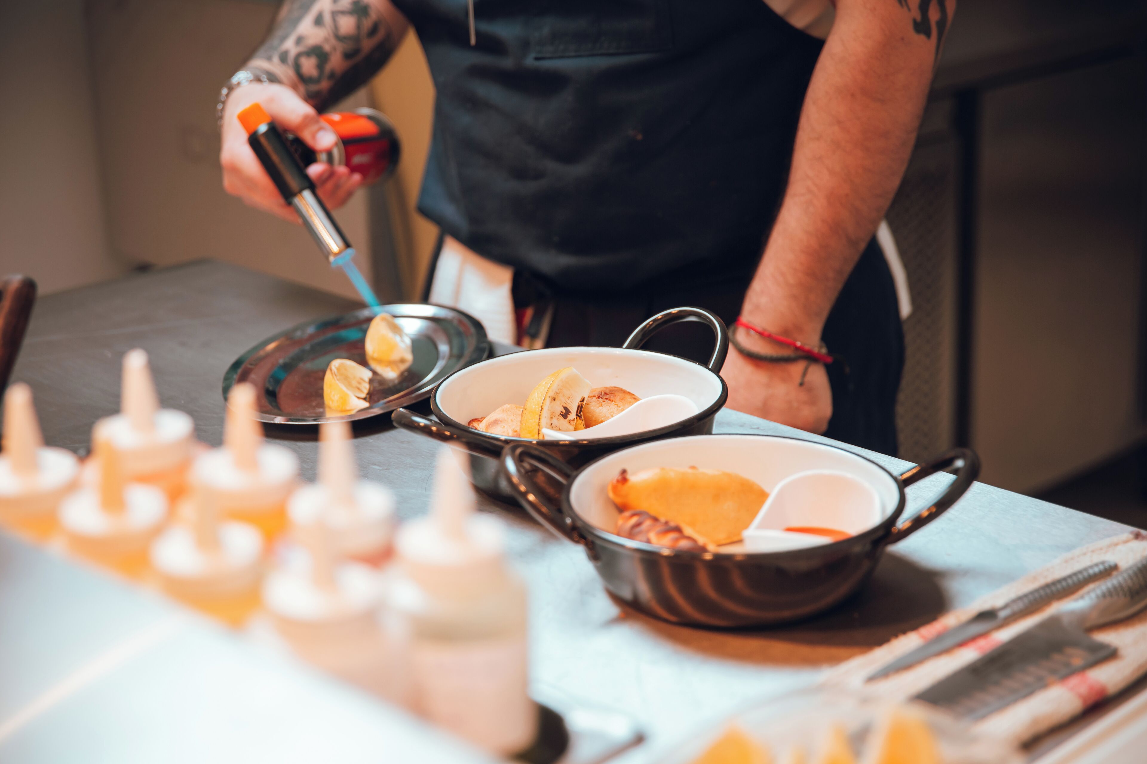 A kitchen with various cooking utensils and ingredients.