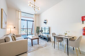 Relax in this stylish living room with a city view, flat-screen TV, and comfortable sofa.