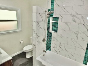 Shower, hair dryer, towels