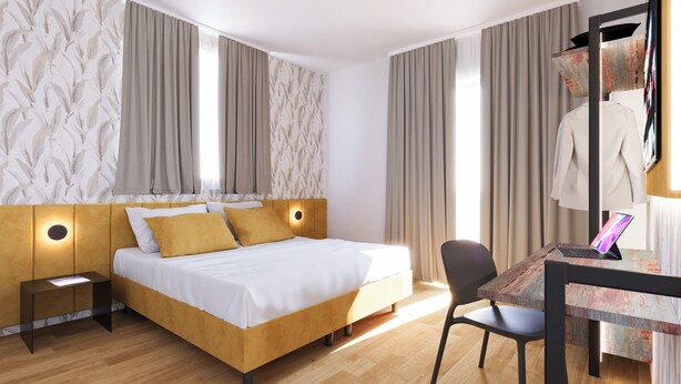 A modern hotel room with a wooden bed, a desk with a laptop, and a chair. - The Place Vaticano 278 (Rome)