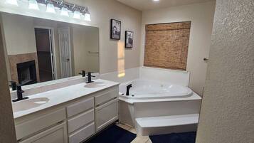 Jetted tub, towels, toilet paper