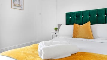 Departamento | 1 habitación, tabla de planchar con plancha, wifi gratis y ropa de cama