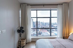 1 bedroom, desk, iron/ironing board, travel crib