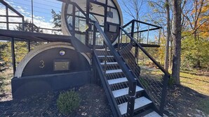 A circular building with a staircase leading to a platform. - LockRidge Park (Lancaster)