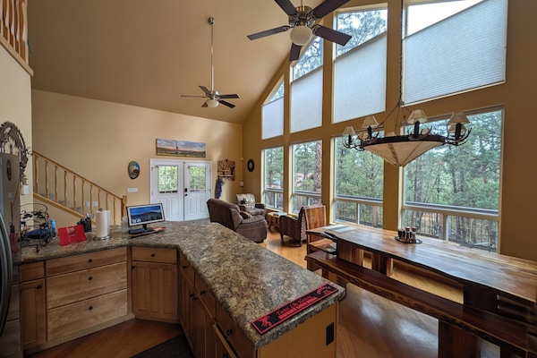 Kitchen view of dining and sitting area