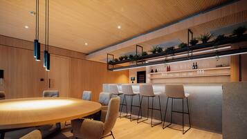 A modern kitchen with a wooden ceiling, bar area, and seating.