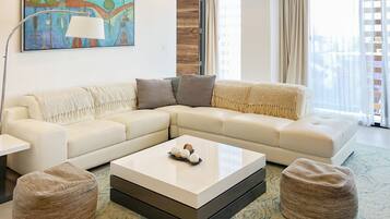 Apartment, Multiple Beds | Living area | 32-inch Smart TV with digital channels