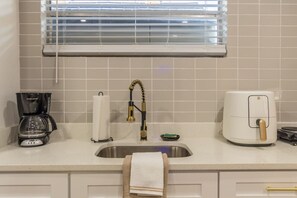 Fridge, microwave, coffee/tea maker, toaster