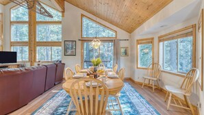 A cozy dining area with a wooden table, chairs, and a rug. - Hansel by Avantstay Pool Table, 5mins to Skiing (Truckee)