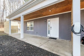 A building with a covered porch, a door, and a number '41A' on the wall.