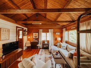 TV, fireplace, books - The Little Lake Cabin with hot tub (New Fairfield)